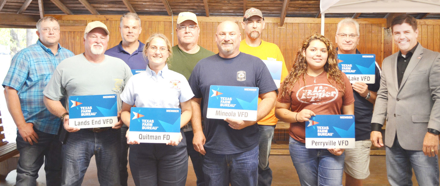 Members of various volunteer fire departments in Wood County were presented with donation checks and Texas Farm Bureau signs by State Representative-elect Cole Hefner. (Photo by Evan Dudley)