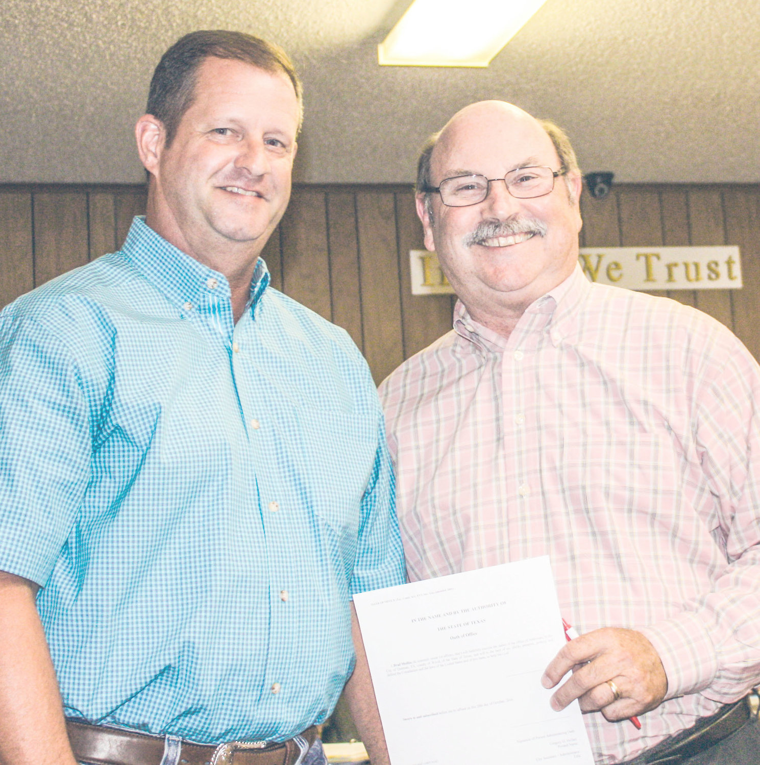 Newly-appointed Quitman City Council Member Brad Medlin displays a big smile just after he had been administered the oath of office Monday evening by Quitman City Secretary-Administrator Greg Hollen, right. (Photo by Tommy Anderson)