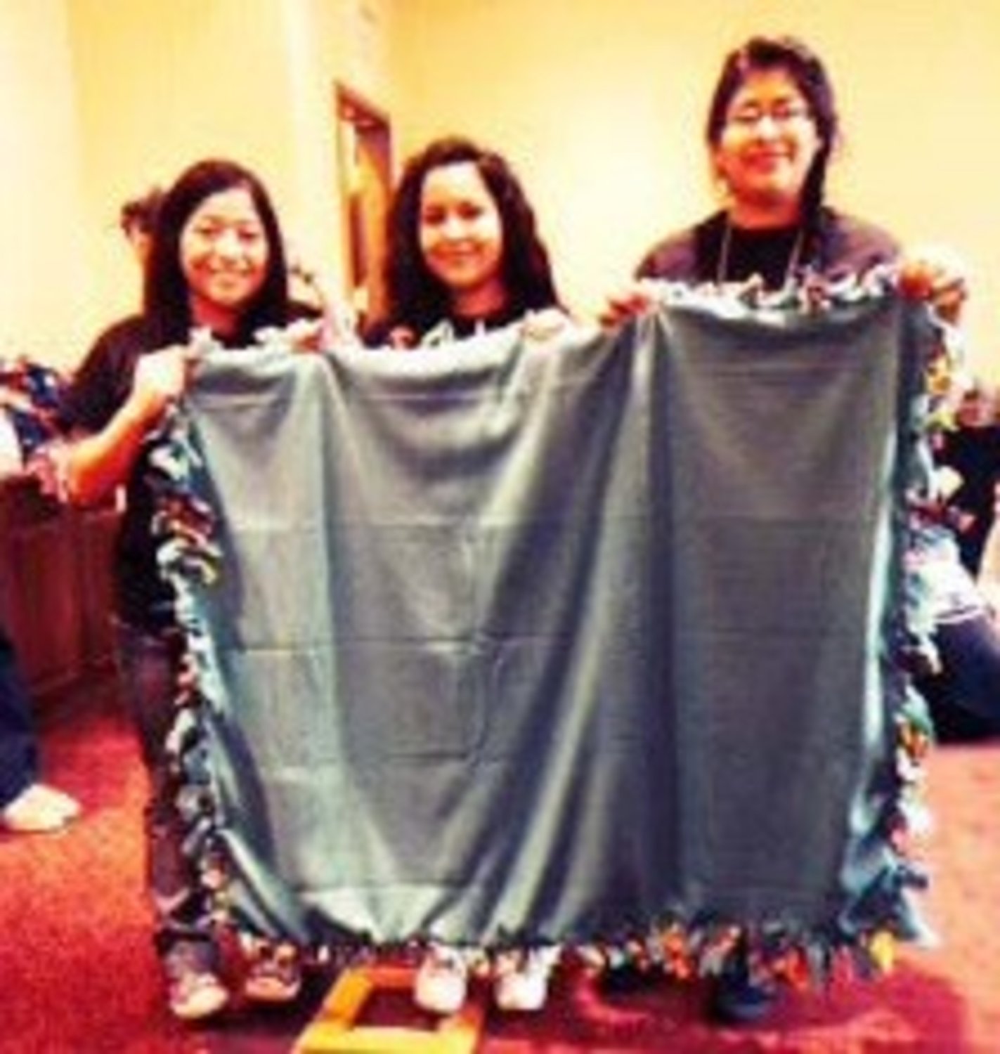 Each Anchor Club member participated in making quilts for the elderly.