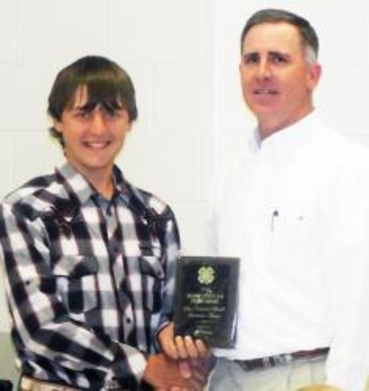 The 2013 "Friend of 4-H" award was given to City National Bank of Quitman. Jerry Jackson (right) accepted the award on the bank's behalf from Tud Krier(left), 4-H Council 2nd Vice President.