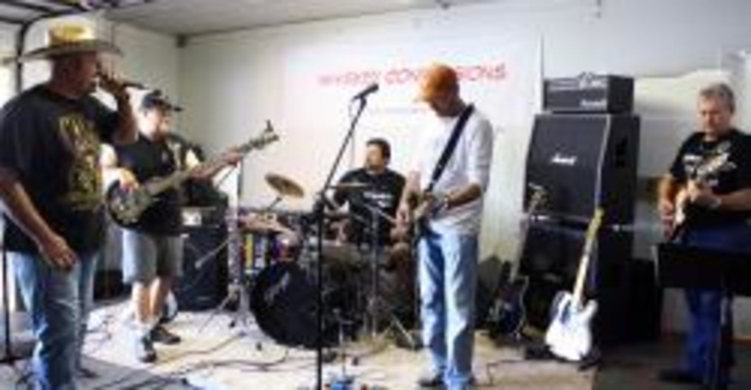Don Woods, Les Paul Clanton, Charles Sharpe, Billy Jack Richardson and Don Bosco practice in their Quit- man, Texas studio for their upcoming shows.
