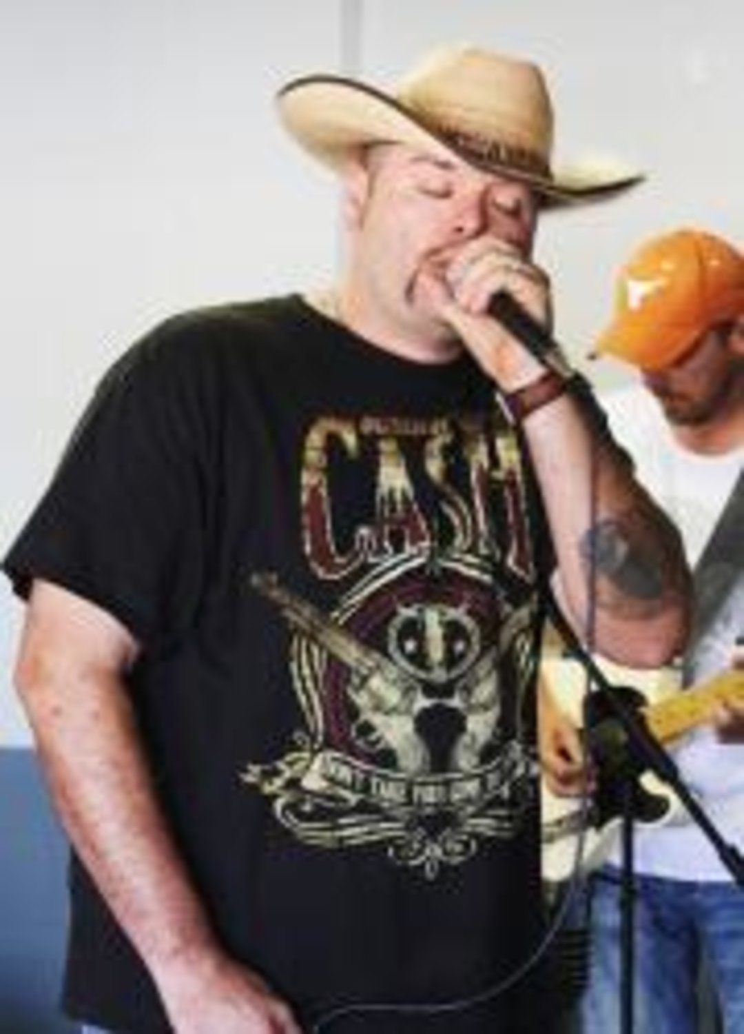 Don Woods, lead singer and founder of Whiskey Confessions Band, rehearses with his bandmates in their Quitman, Texas studio.