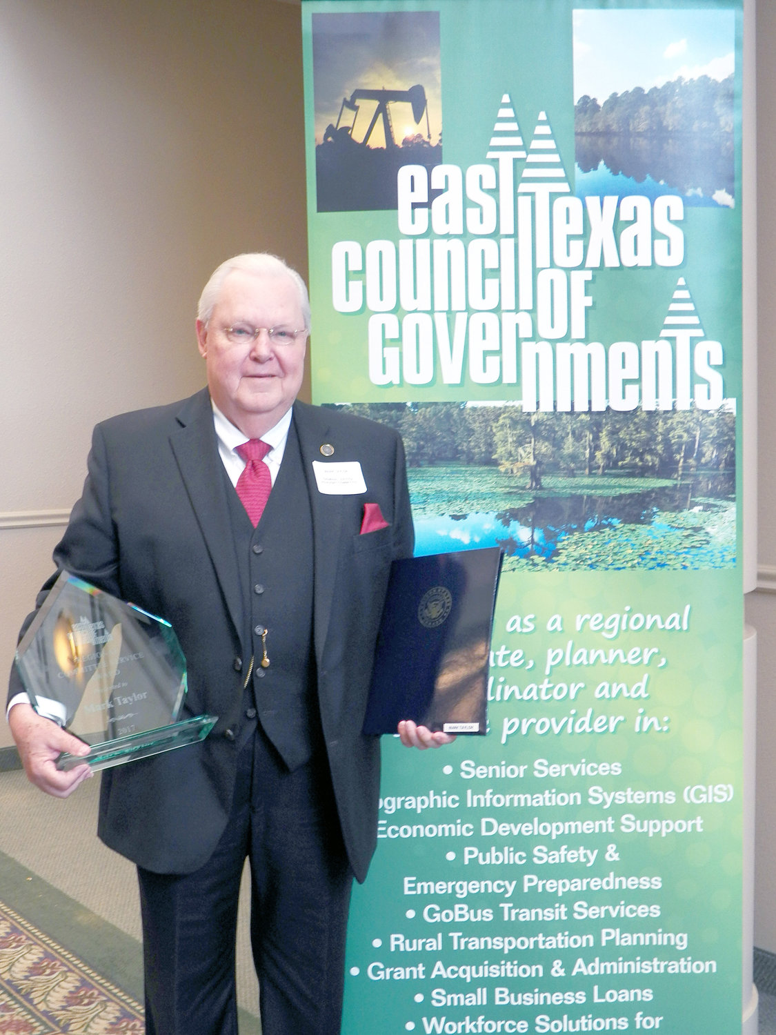Former Wood County District Attorney Mark Taylor has received a service award from the East Texas Council of Governments.