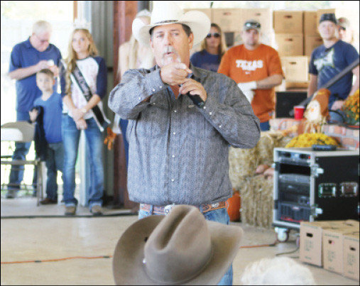 This photo of an auctioneer at the Golden Sweet Potato Festival, by Editor Doris Newman, helped the Monitor win a fourth place in feature photos at the North and East Texas Press Association  conference.