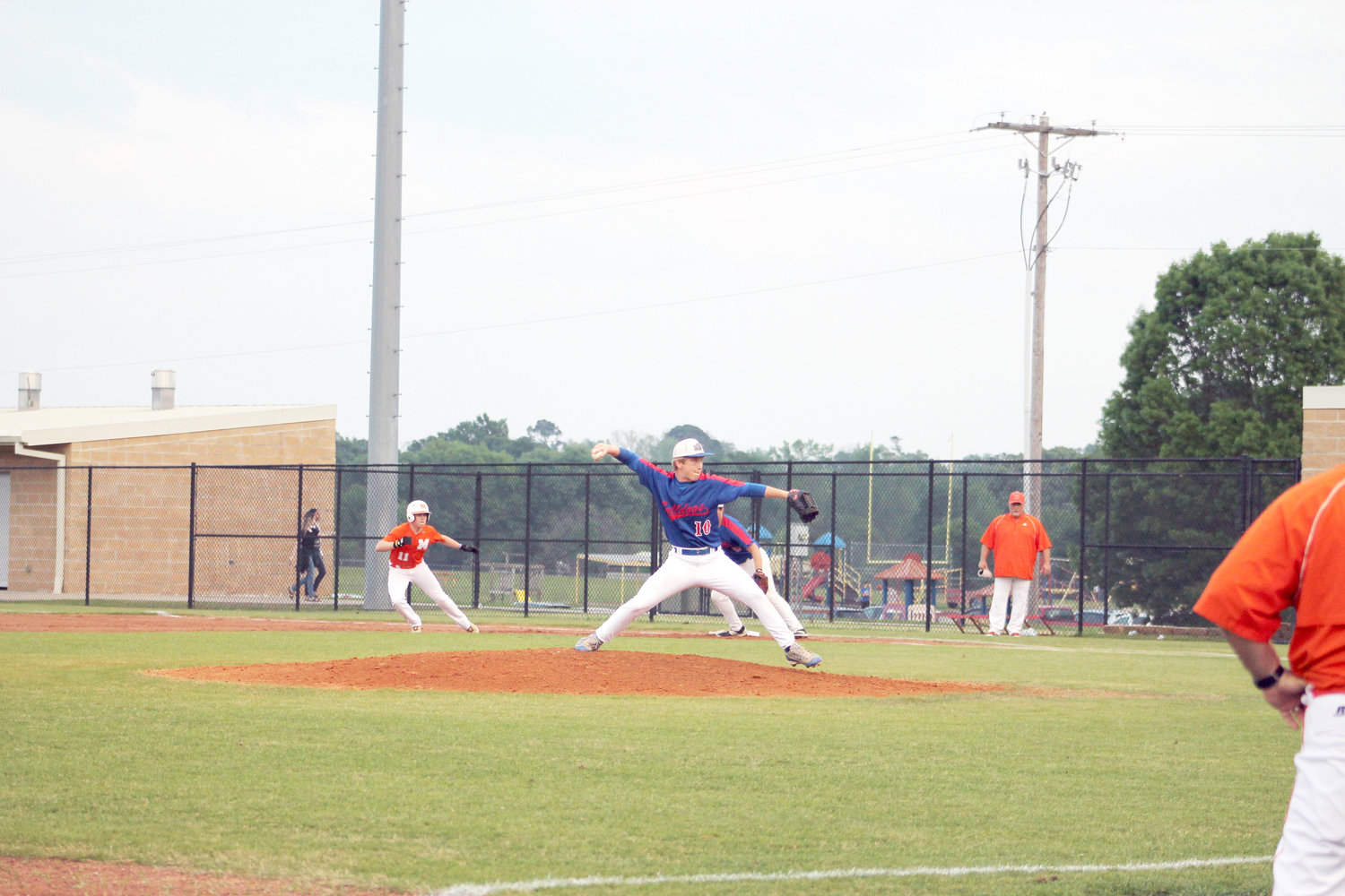 Seth Hudgins leans off first in the game against Quitman last Tuesday as Bulldog Pitcher A.J. Dunn hurls the ball.