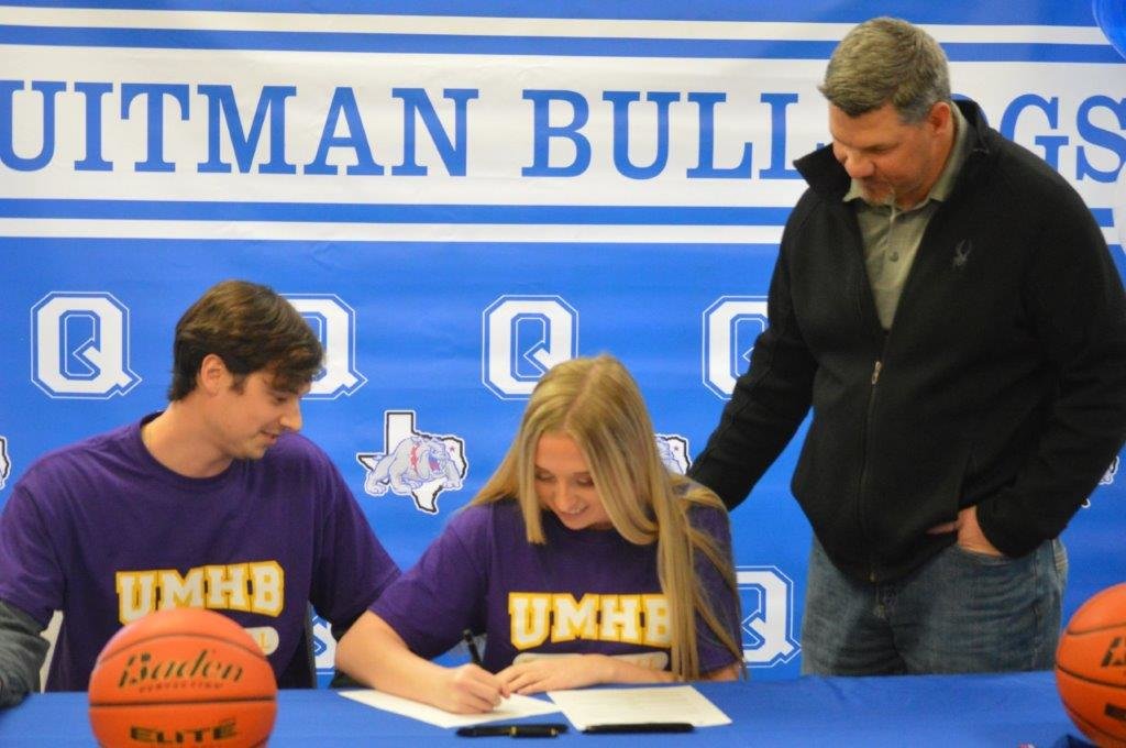 Quitman’s Maddy Whitehurst is pictured with Lady Bulldog basketball coach Blake Hamrick (left) and Athletic Director Bryan Oakes signing with the University of Mary Hardin Baylor (UMHB) to play basketball in the 2020-2021 season. UMHB is an NCAA Division III school playing in the American Southwest Conference and is located in Belton. (Monitor photo by Larry Tucker)