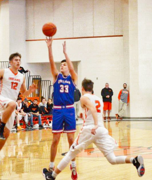 Jace Reid takes a long shot against Grand Saline earlier this year.