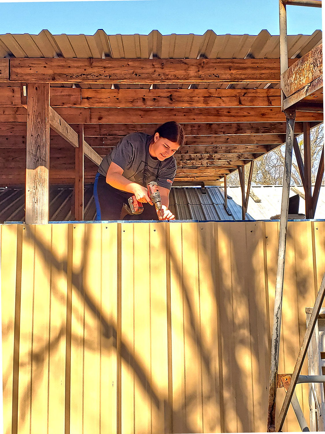 Maggie Robinson works on the first tiny home being built by the Second Chance Homes by Second Chance Hands program at the Recovery Ranch near Mineola. (Courtesy photo)