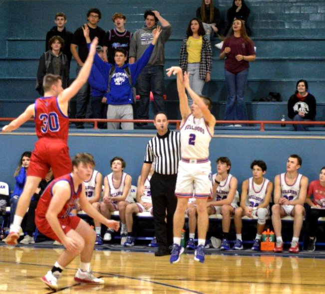 Quitman’s Ford Tannebaum hits one of back-to-back successful three-point shots for Quitman to start the second half in the Bulldog win over Alba- Golden.