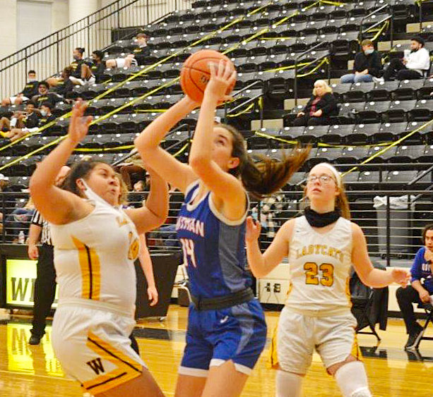 Quitman’s Ava Burroughs (14) hits for two of her career high 32 points in the Lady Bulldogs’ district win at Winona last Tuesday night. Burroughs also added 16 rebounds.