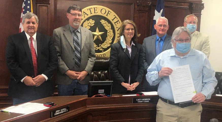 Wood County Child Welfare Board President Sam Scroggins is pictured with a proclamation making April Child Abuse Awareness and Prevention Month. Behind Scroggins are Virgil Holland, Jerry Gaskill. Judge Lucy Hebron, Mike Simmons and Russell Acker. (Monitor photo by Larry Tucker)
