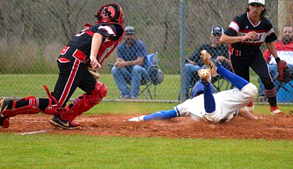 Quitman’s Ty Holland hustles to the plate with a headfirst slide to score in Friday’s win over Mount Pleasant Chapel Hill.