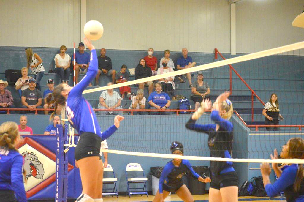 Ava Burroughs (14) scores against Big Sandy with this placement shot over the Lady Wildcat block attempts.