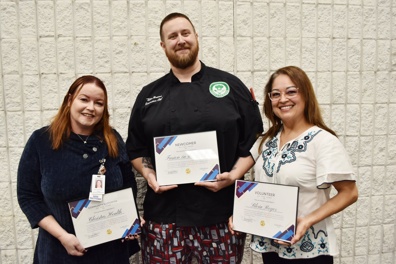 The Mineola Chamber of Commerce passed out membership awards last Thursday at the annual meeting, from left, Janie Johnson of Christus Trinity Mother Frances as business supporter of the year, Chef Tyler Brown of Fusion in the Woods as new member of the year and Silvia Reyes as volunteer of the year.