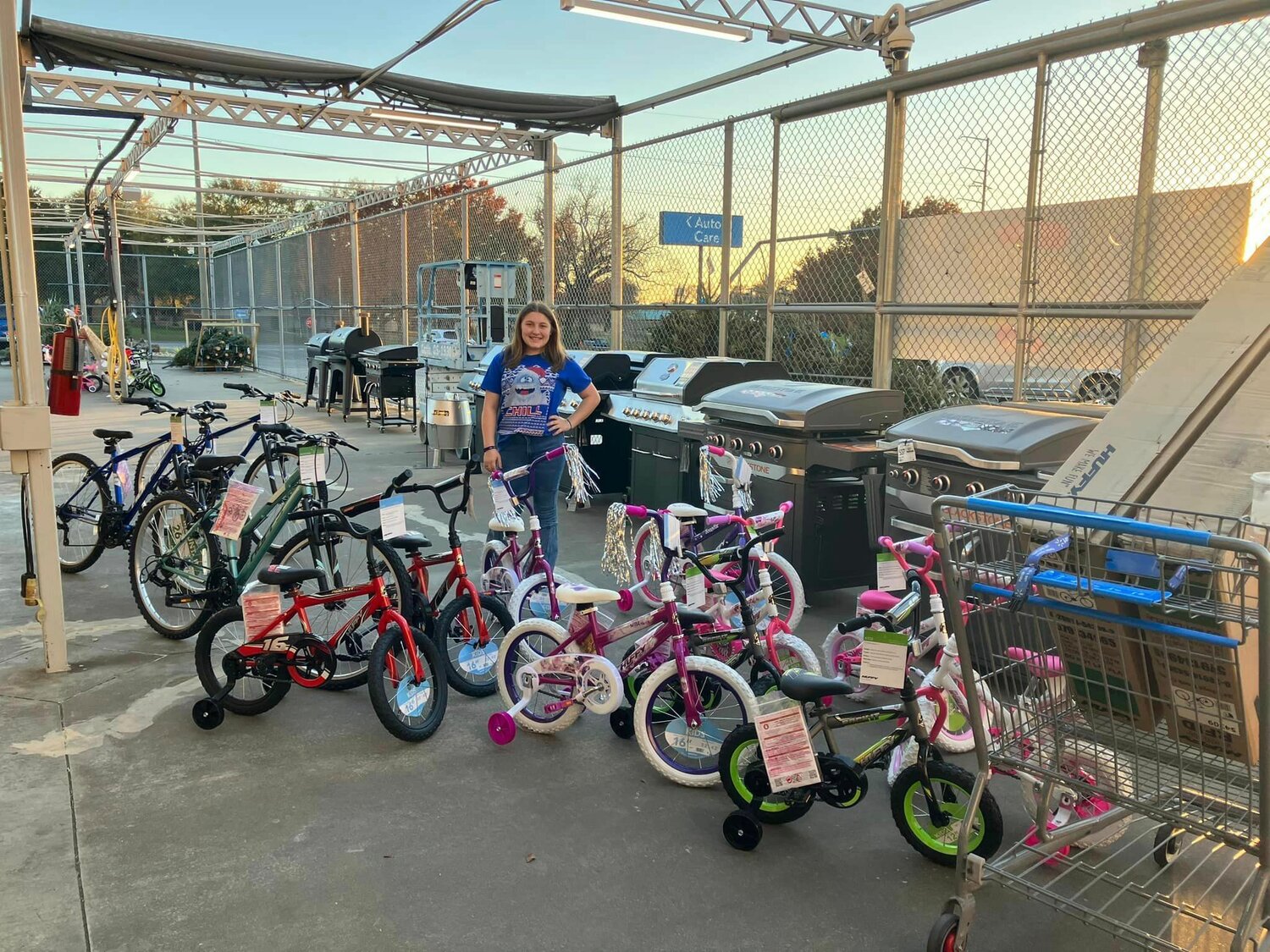 Ryleigh Adams gathers bicycles purchased for the Alba-Golden Angel Tree.