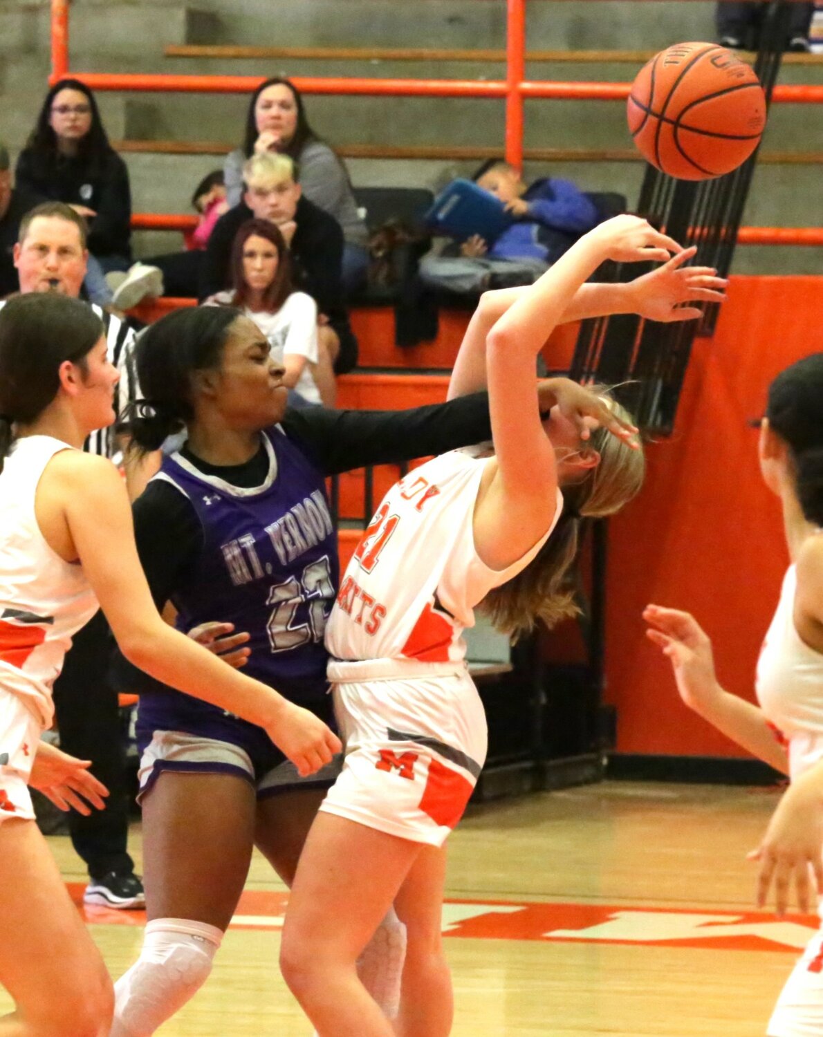 Basketball is certainly a contact sport. Mineola’s Kali Chrietzberg takes a forearm to the head in action against Mt. Vernon.
