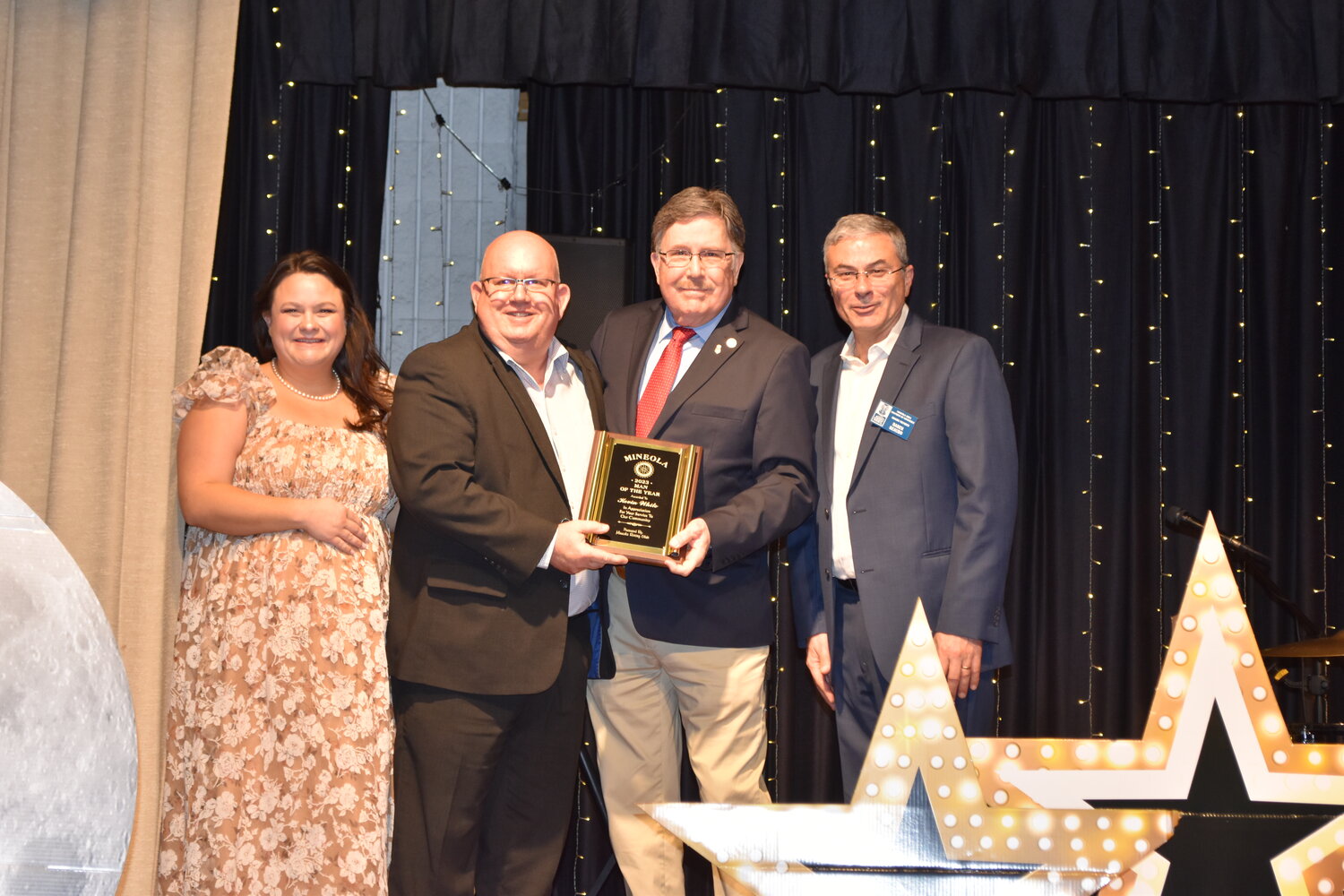 Mineola Man of the Year Kevin White, second from left, is congratulated by presenter Roy Shockey, Chamber President Kelsie McGilvray and Vice President Daren Beaudo.