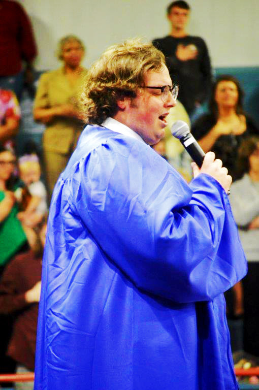 2021 grad Bobby Irwin sings the National Anthem at the Quitman High School graduation Friday.