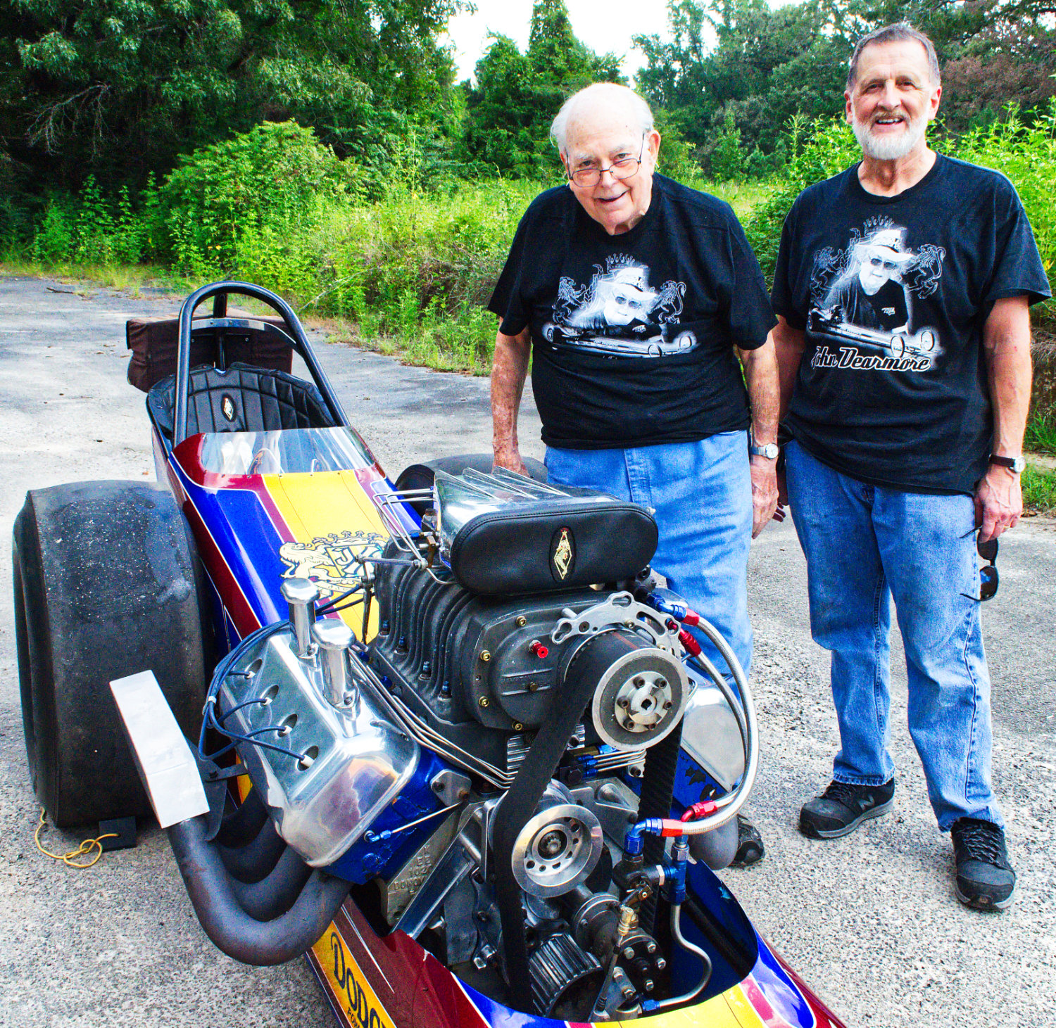 John Dearmore, left, with Keith Redfearn and Dearmore’s restored 1970 top fuel dragster. Dearmore is celebrating 65 years in the racing business with a final tour.
