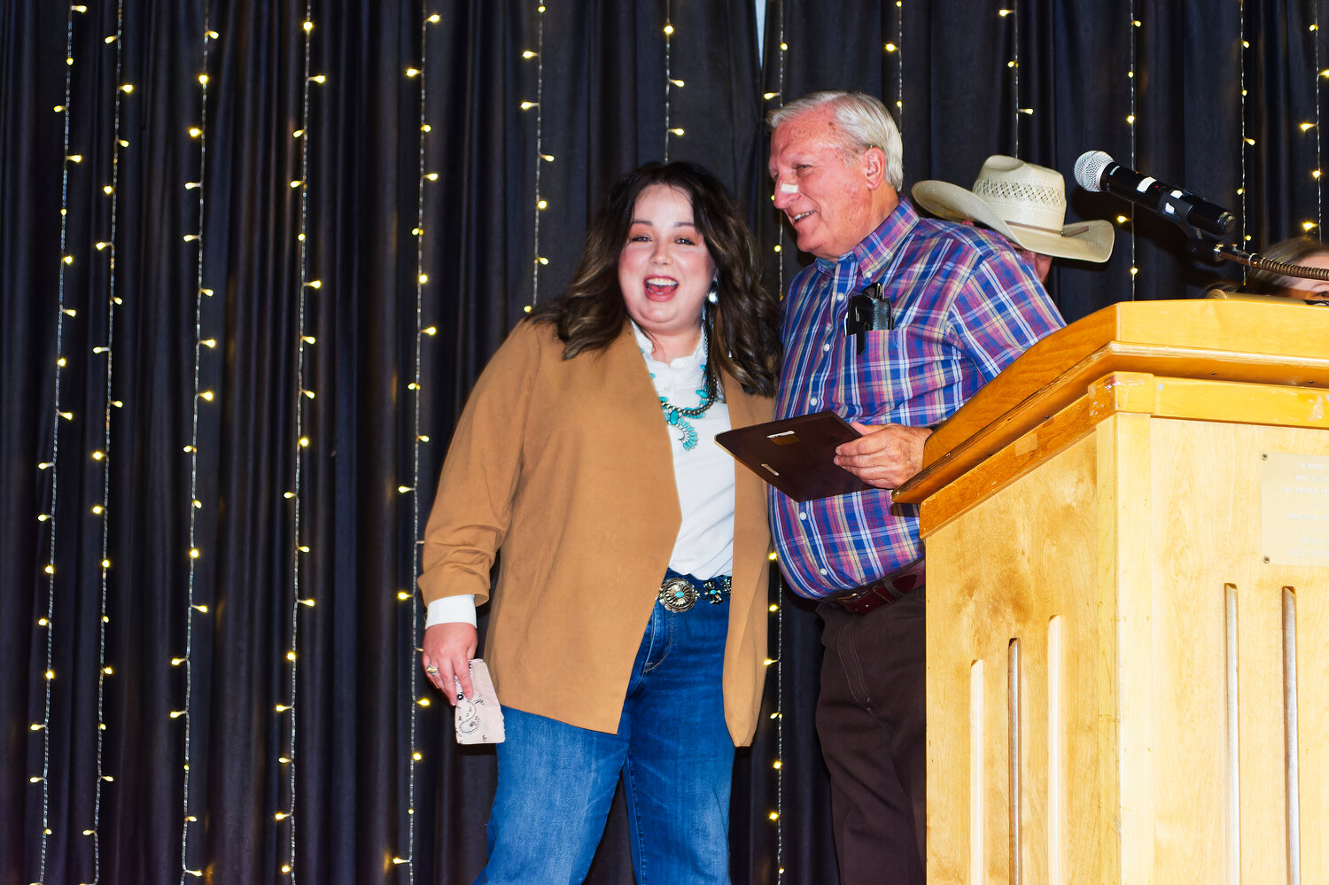 Jackie Rodieck congratulates Glen Dossett on his induction into the Agriculture Teachers of Texas Association’s hall of fame.