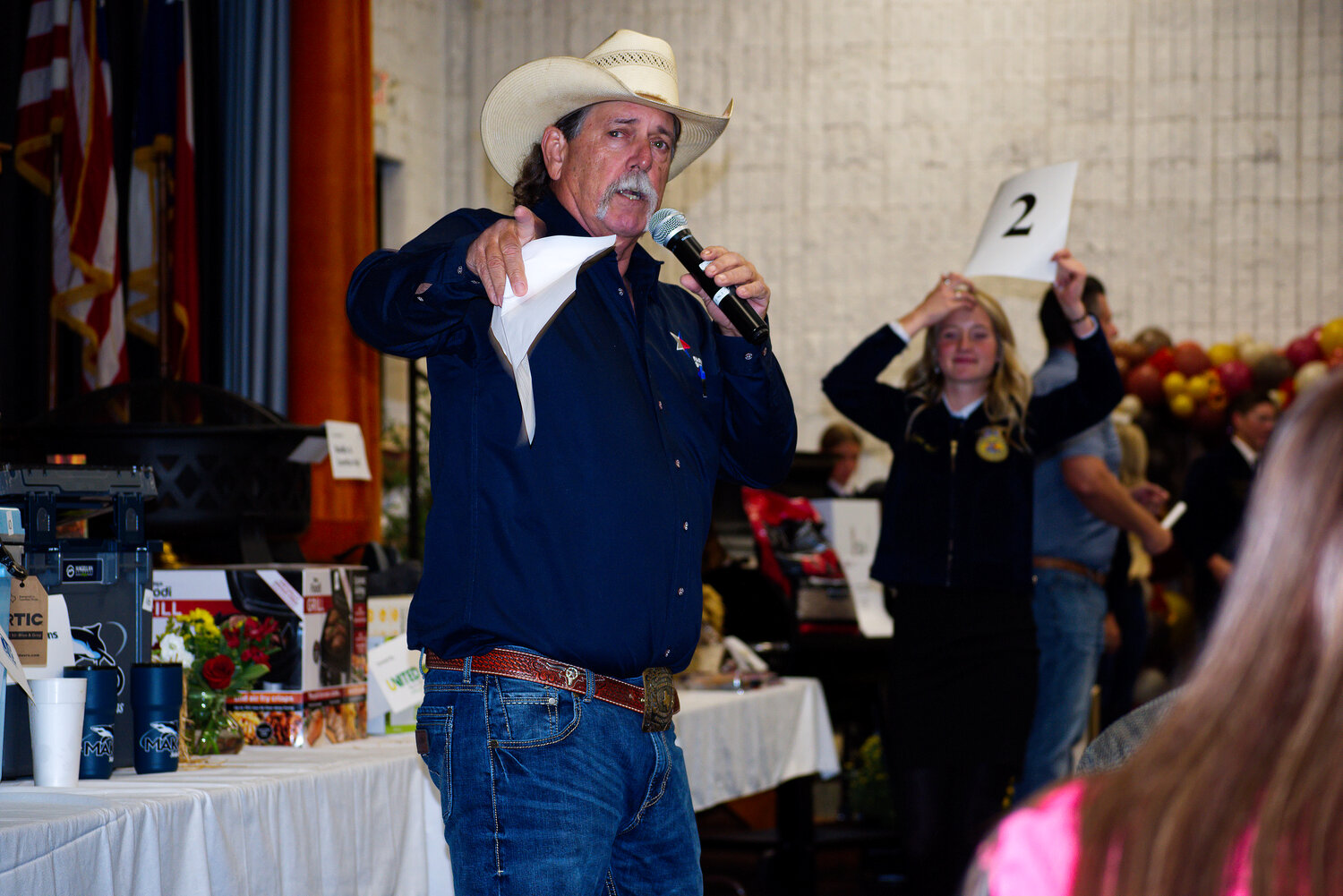 Kelly Conley reprised his role as auctioneer for the Mineola Hay Show Sept. 12.